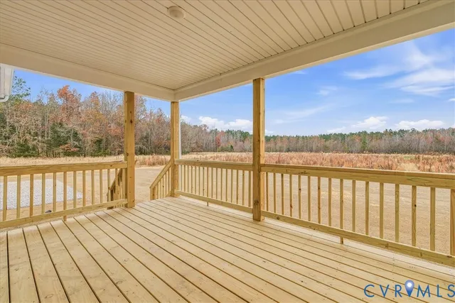 a view of a balcony with wooden floor