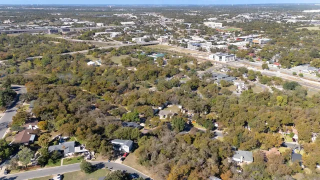an aerial view of a city with lots of residential buildings