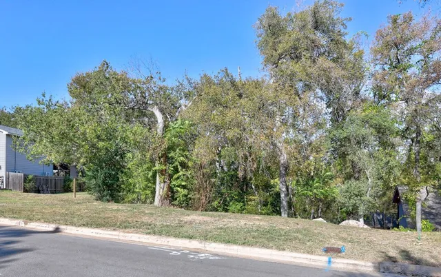 a view of a road with a building in the background