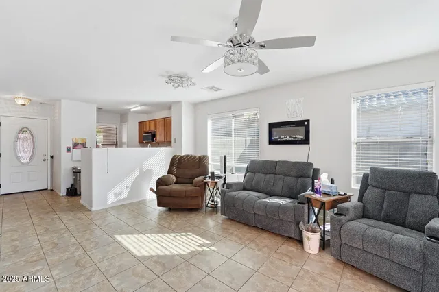 a living room with furniture and a window