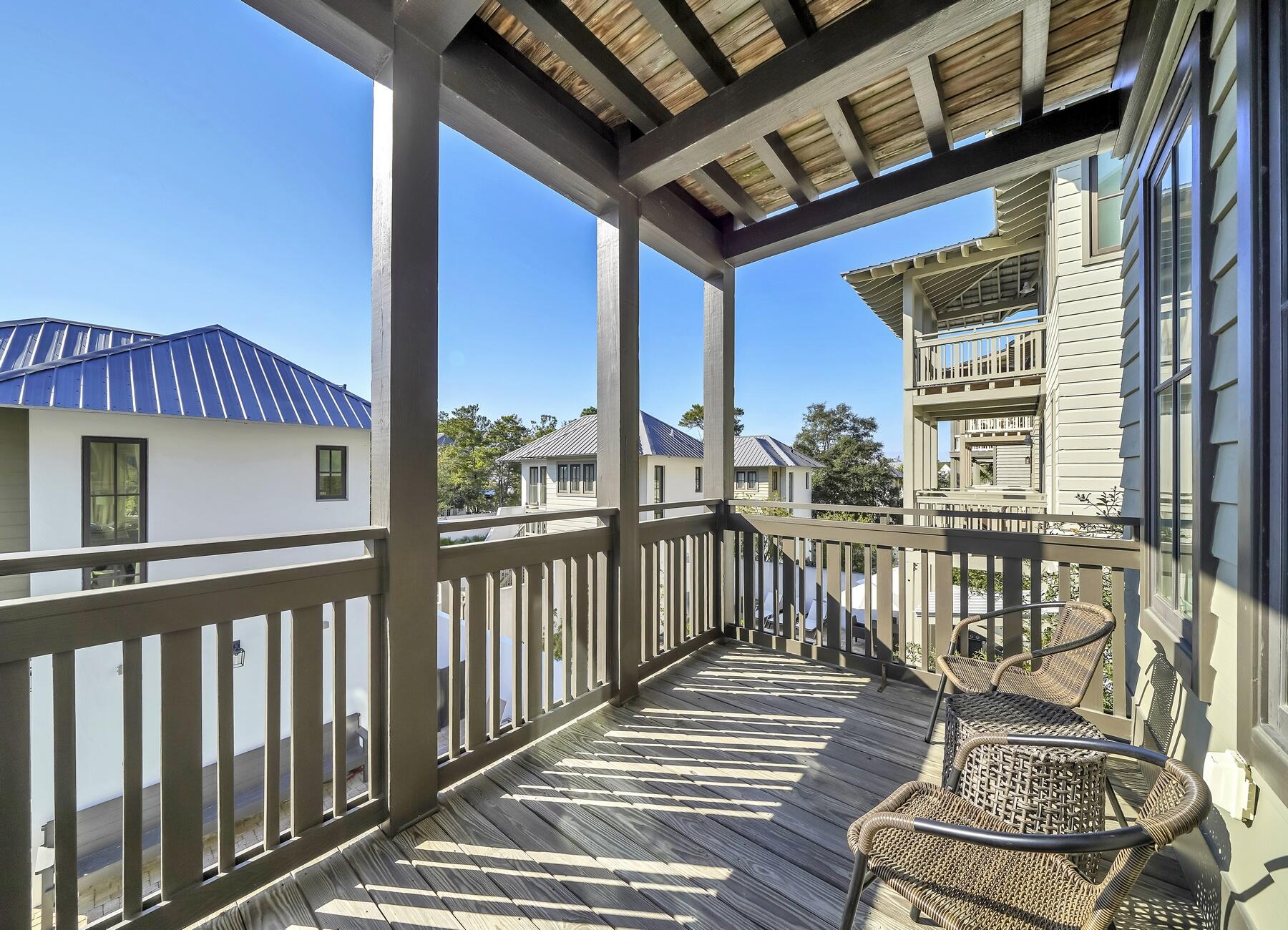76 North Winston Ln Inlet Beach Inlet Beach, FL 32461 - Photo 16 of 69 a view of a balcony with chairs