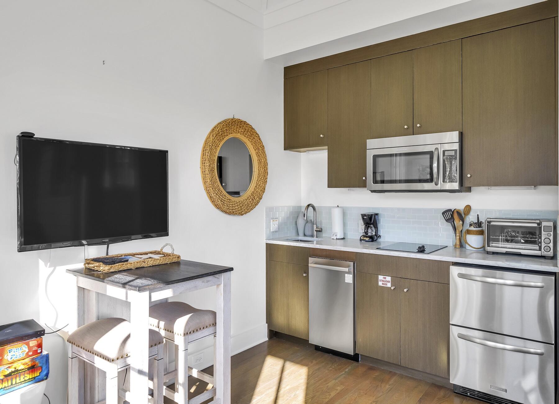 76 North Winston Ln Inlet Beach Inlet Beach, FL 32461 - Photo 19 of 69 a kitchen with stainless steel appliances granite countertop a stove a sink and a microwave