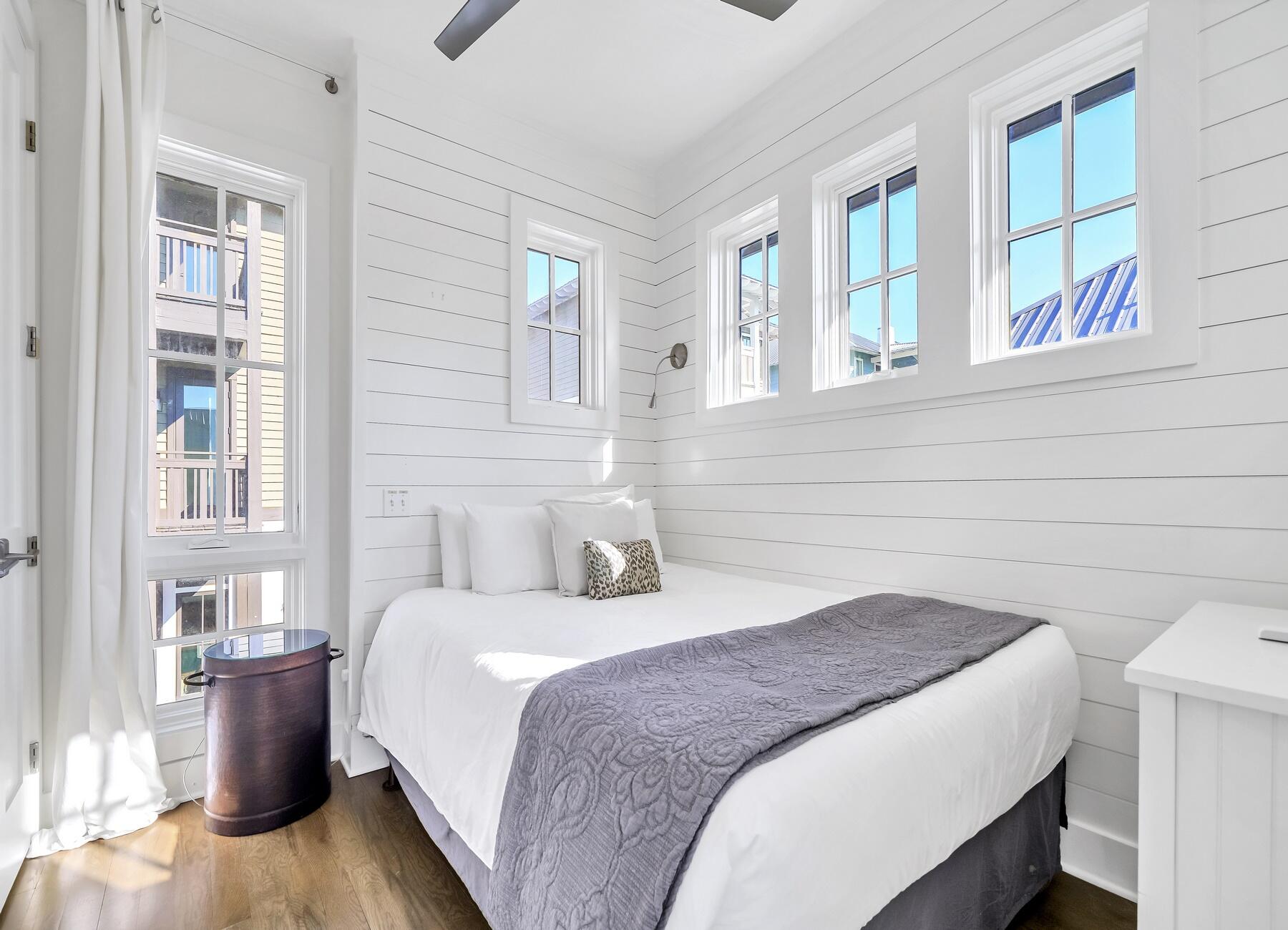 76 North Winston Ln Inlet Beach Inlet Beach, FL 32461 - Photo 21 of 69 a bedroom with a bed and wooden floor