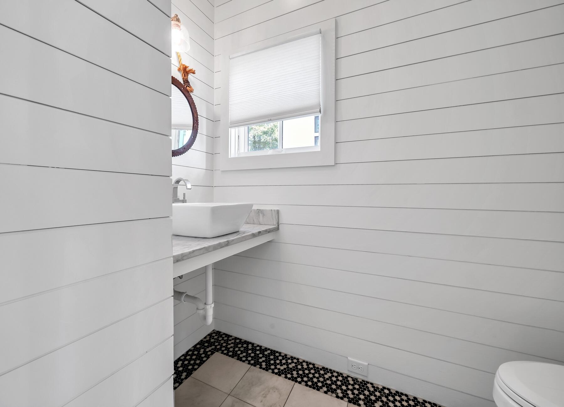 76 North Winston Ln Inlet Beach Inlet Beach, FL 32461 - Photo 23 of 69 a bathroom with a sink and a toilet