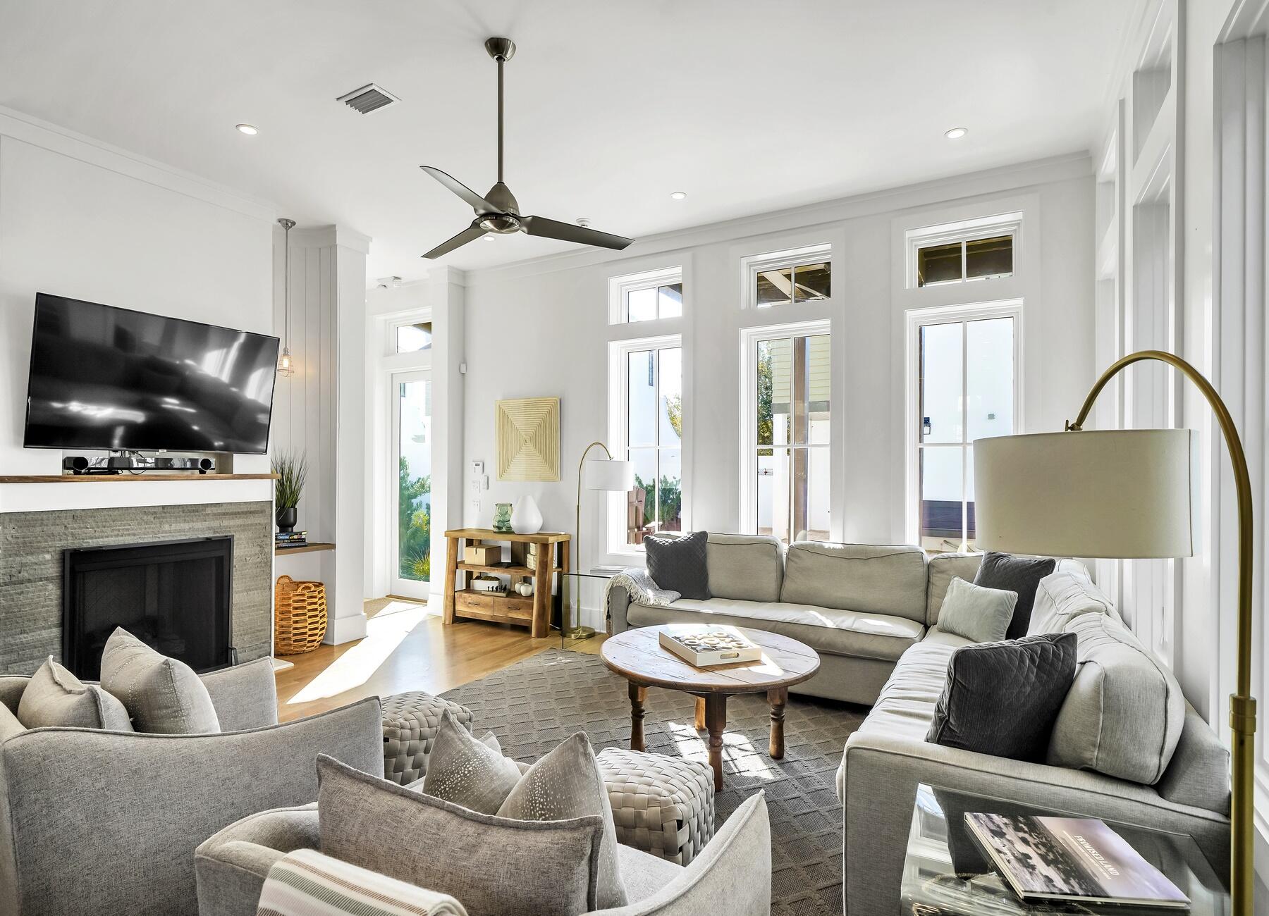 76 North Winston Ln Inlet Beach Inlet Beach, FL 32461 - Photo 27 of 69 a living room with furniture a fireplace and a flat screen tv