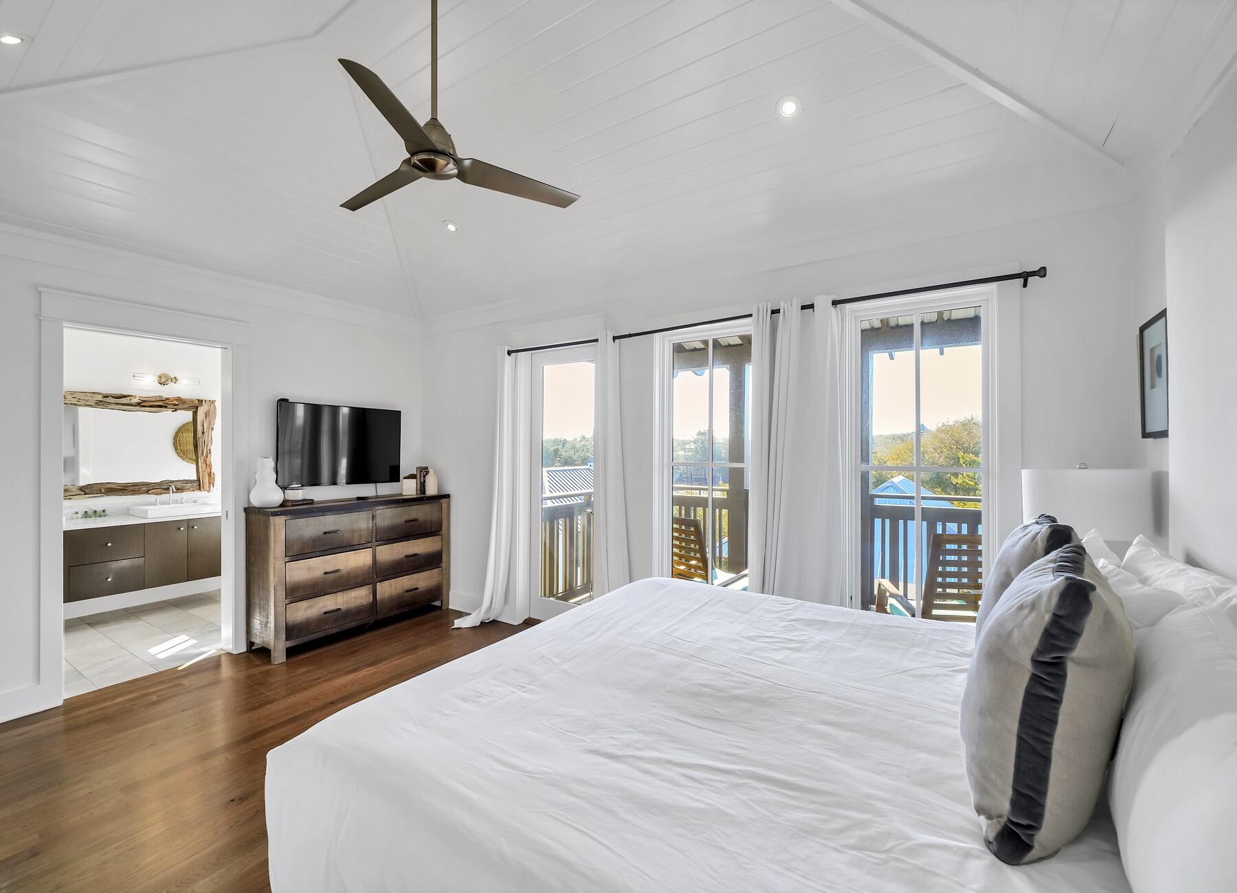 76 North Winston Ln Inlet Beach Inlet Beach, FL 32461 - Photo 49 of 69 a bedroom with a bed and wooden floor