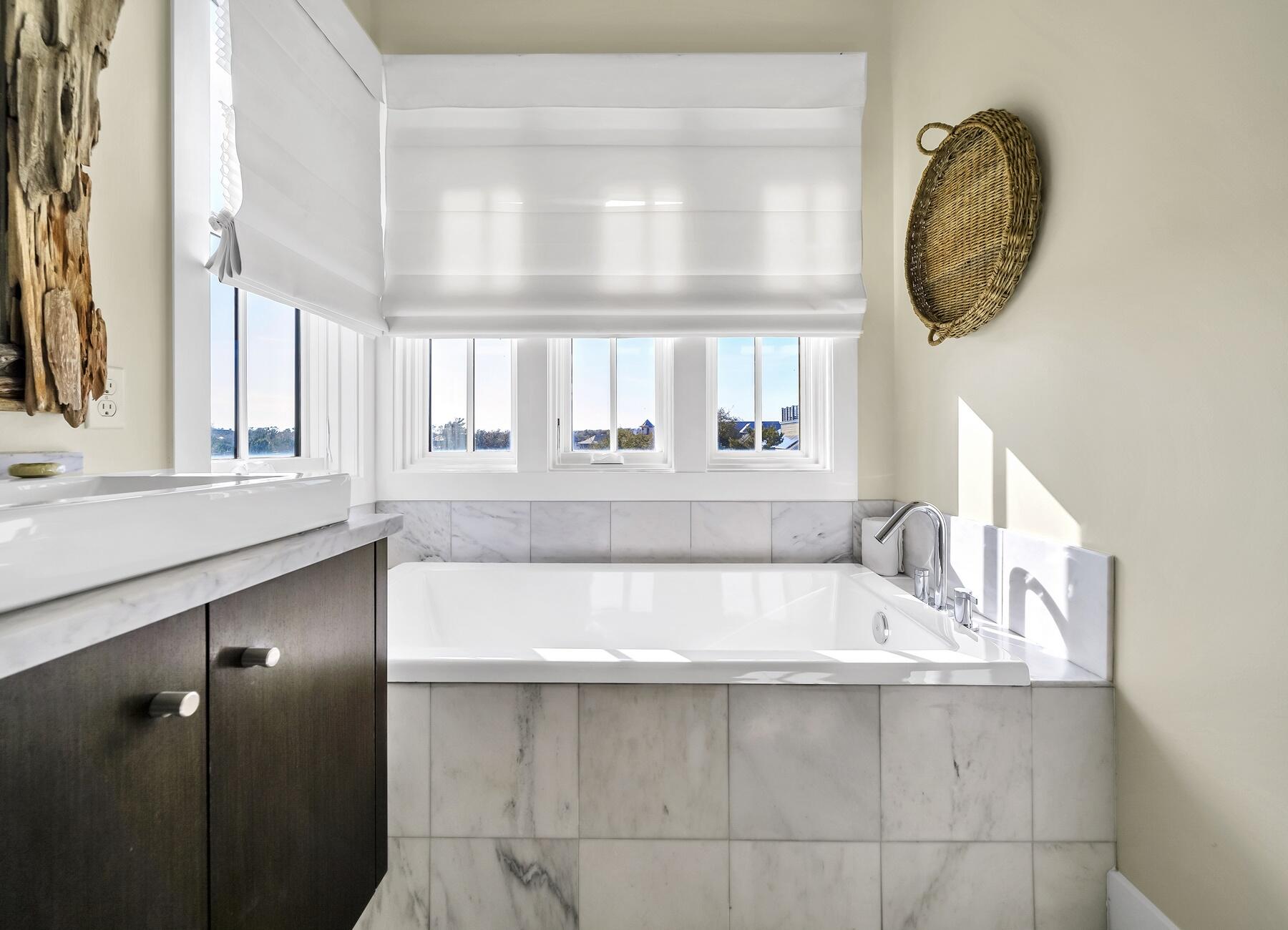 76 North Winston Ln Inlet Beach Inlet Beach, FL 32461 - Photo 51 of 69 a bathroom with a bathtub a sink and a window