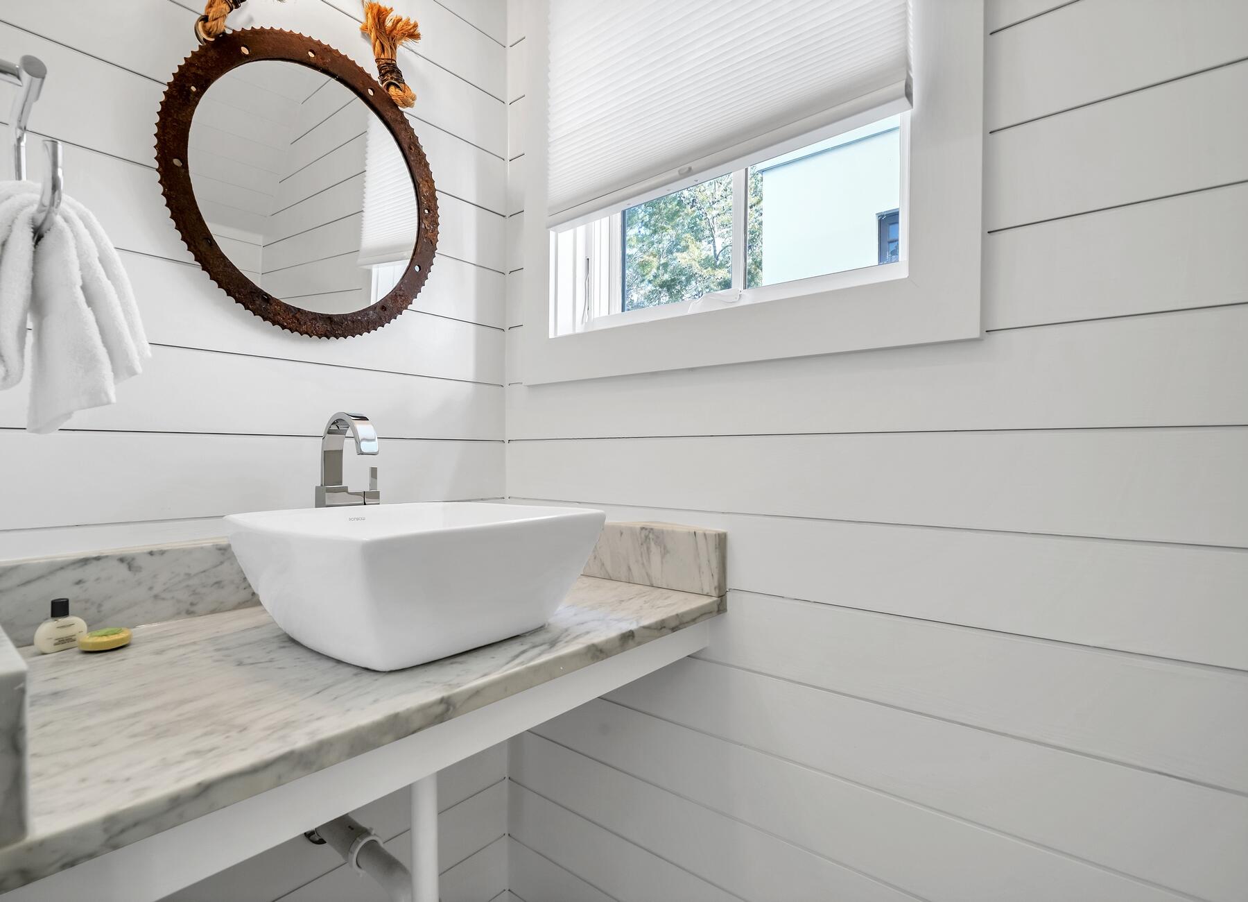 76 North Winston Ln Inlet Beach Inlet Beach, FL 32461 - Photo 53 of 69 a bathroom with a sink and a mirror