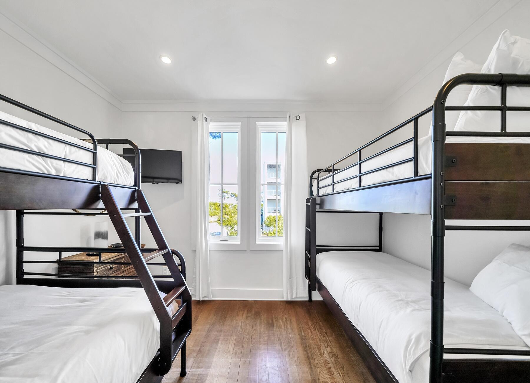 76 North Winston Ln Inlet Beach Inlet Beach, FL 32461 - Photo 58 of 69 a bedroom with wooden floor and window