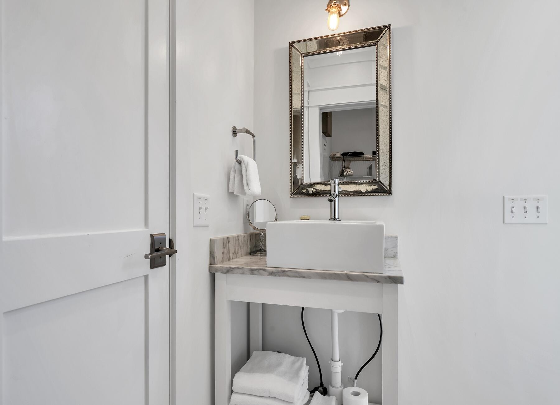 76 North Winston Ln Inlet Beach Inlet Beach, FL 32461 - Photo 62 of 69 a bathroom with a toilet sink and mirror