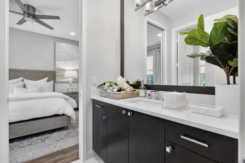 a bathroom with a sink double vanity and a mirror
