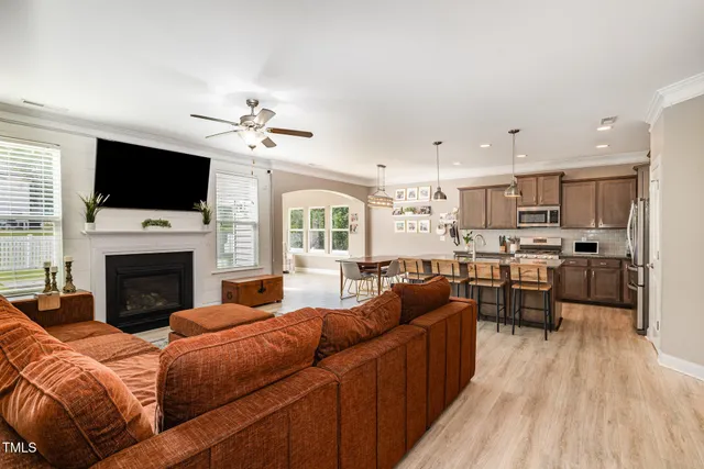 a living room with furniture fireplace and flat screen tv