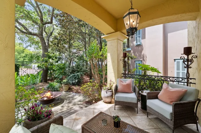 a backyard of a house with table and chairs