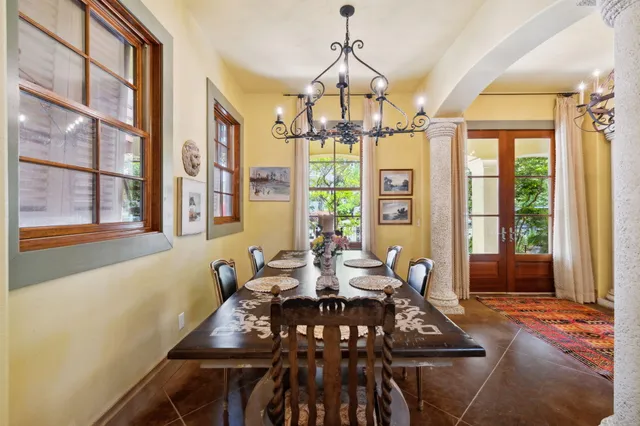 a view of a kitchen with a table and chairs in it