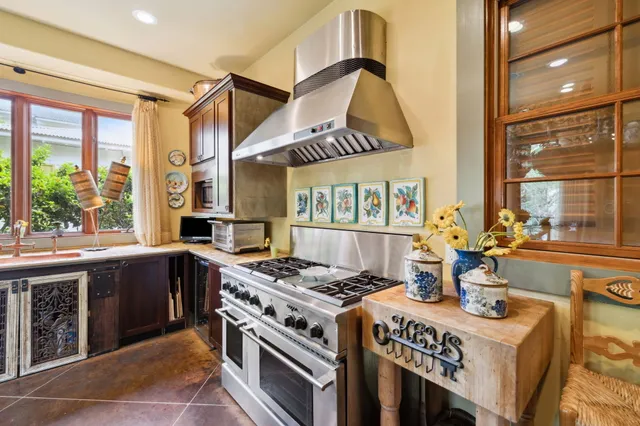 a bathroom with a granite countertop mirror and a shower