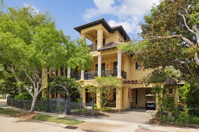 a front view of a house with tree s