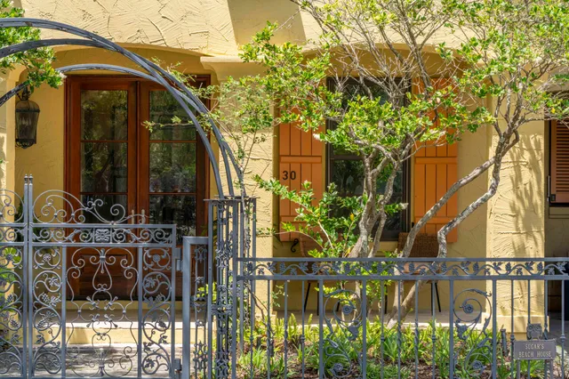 a view of a porch with furniture and floor to ceiling window