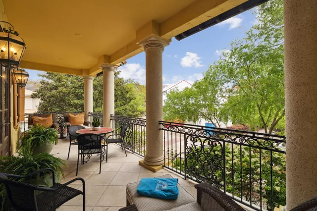 an aerial view of a house with a garden and lake view