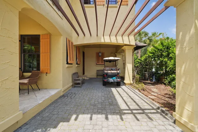 a couple of potted plants sitting in front of a house