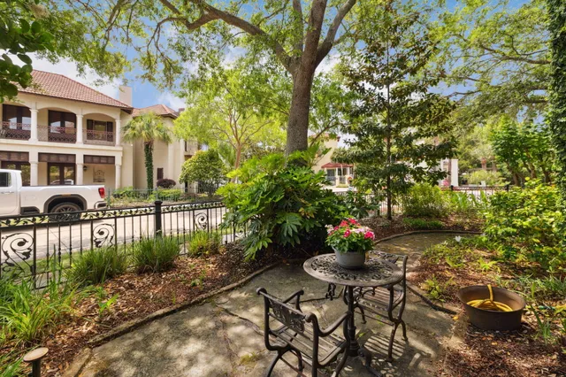 a view of a patio with couches and potted plants