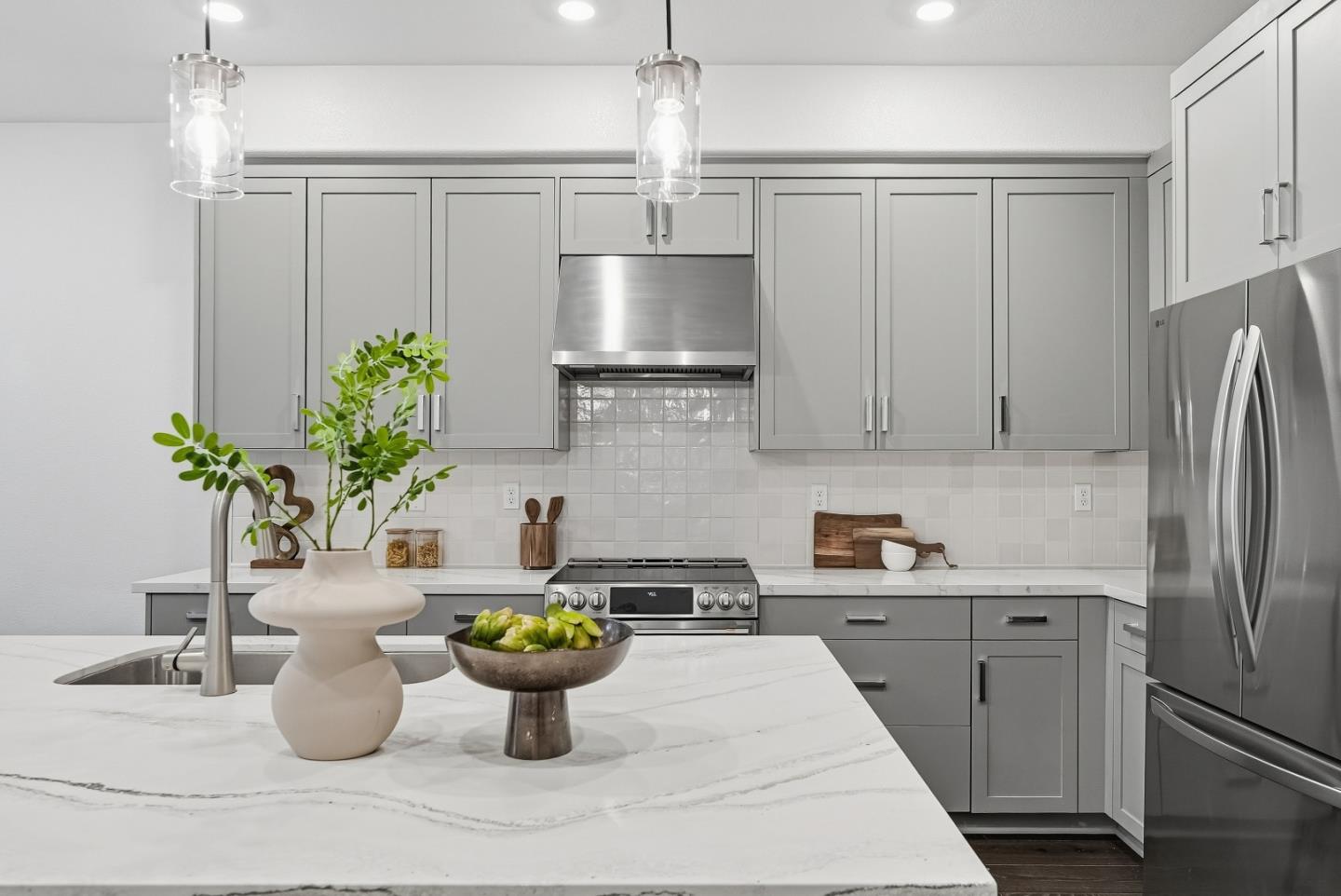 21504 Point Reyes Terrace Cupertino, CA 95014 - Photo 11 of 55 a kitchen with a refrigerator and a white table
