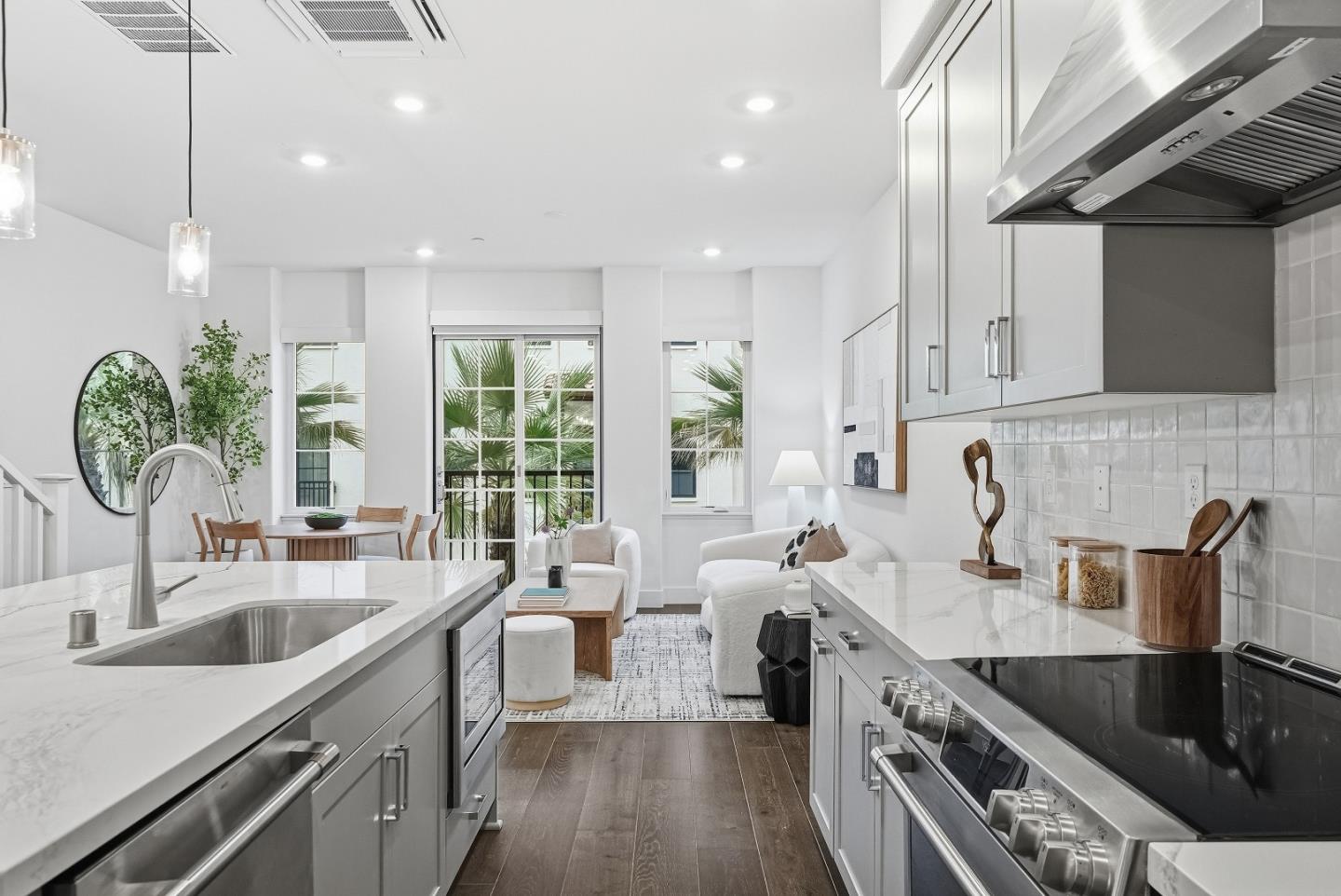 21504 Point Reyes Terrace Cupertino, CA 95014 - Photo 12 of 55 a kitchen with stainless steel appliances a sink a stove and a wooden floors