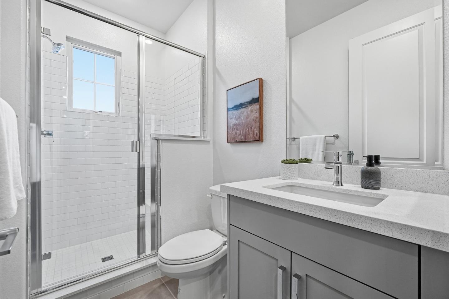 21504 Point Reyes Terrace Cupertino, CA 95014 - Photo 14 of 55 a bathroom with a sink toilet and shower