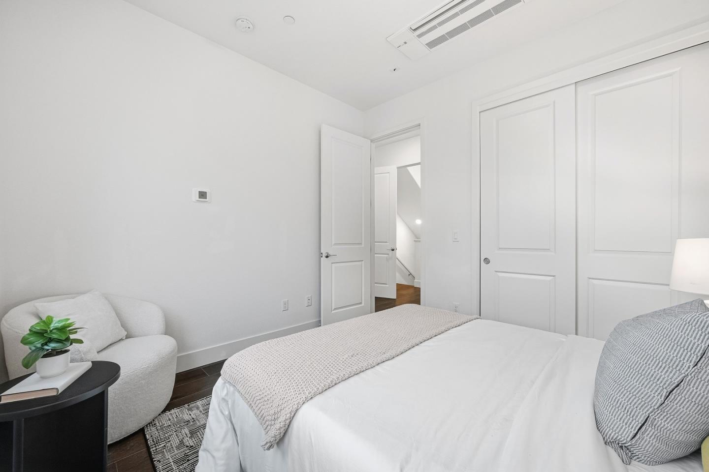 21504 Point Reyes Terrace Cupertino, CA 95014 - Photo 15 of 55 a bedroom with a bed and a couch