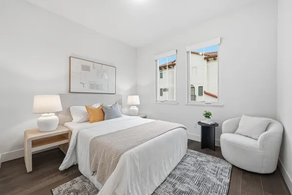 a bedroom with a bed and a couch