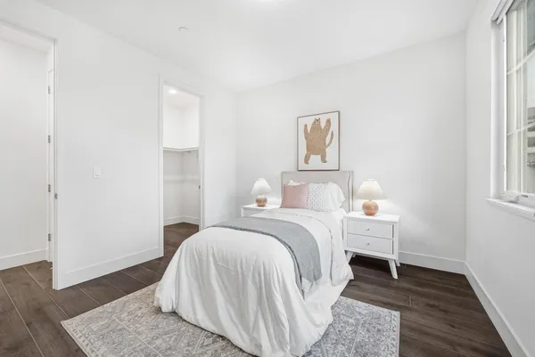 a bed room with a bed and a window