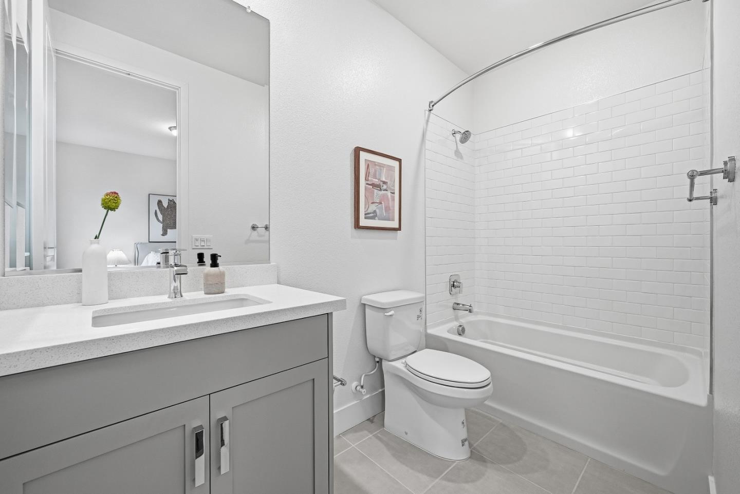 21504 Point Reyes Terrace Cupertino, CA 95014 - Photo 21 of 55 a bathroom with a toilet sink a shower and a mirror