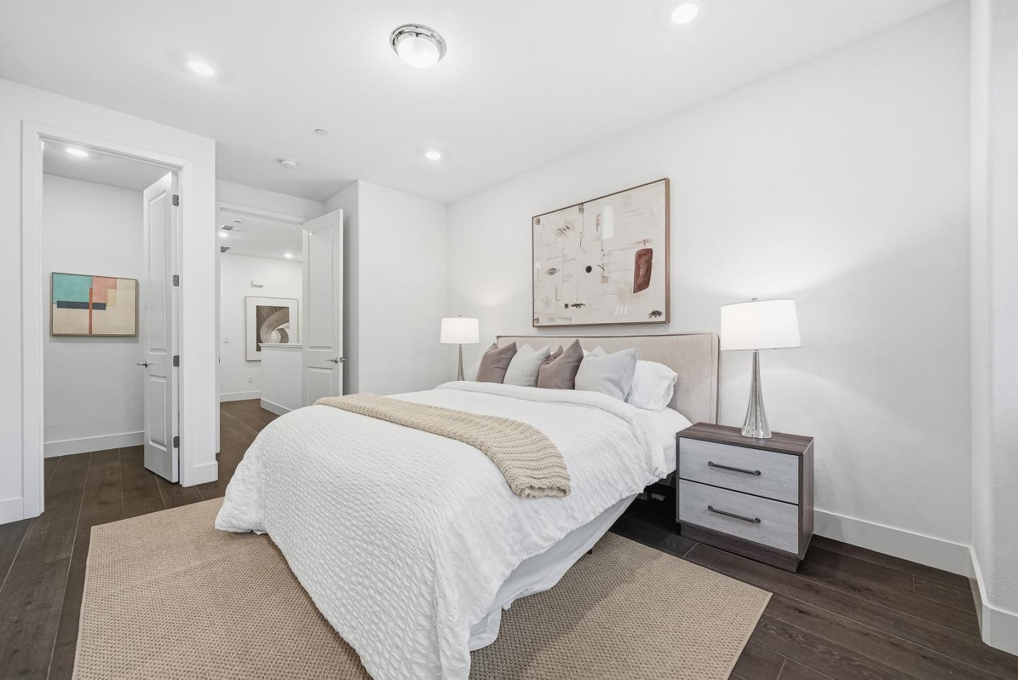 21504 Point Reyes Terrace Cupertino, CA 95014 - Photo 24 of 55 a bedroom with a bed and a night stand