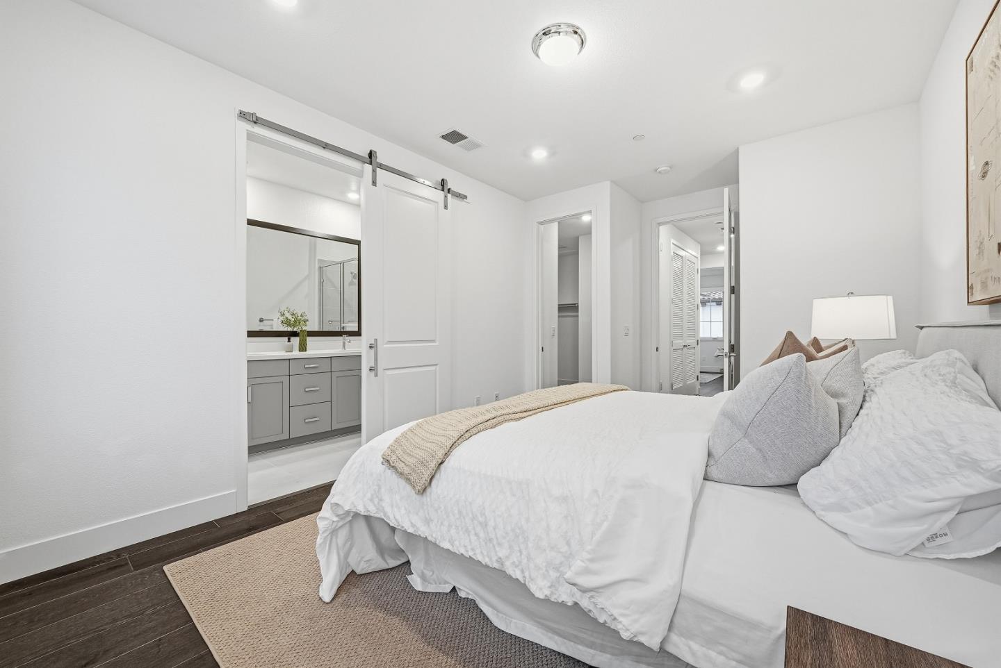 21504 Point Reyes Terrace Cupertino, CA 95014 - Photo 25 of 55 a spacious bedroom with a bed and a flat screen tv