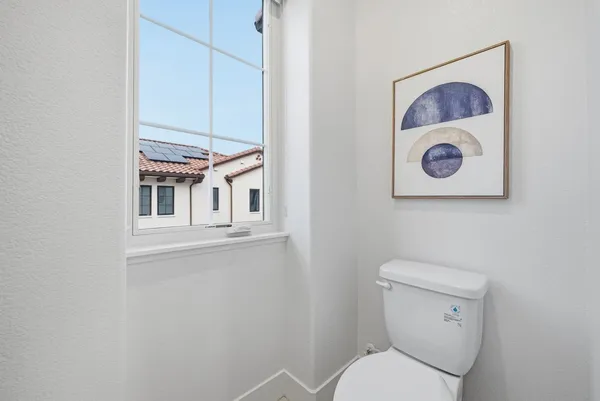 a bathroom with a toilet and a sink