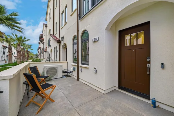 a view of a house with a yard and plants