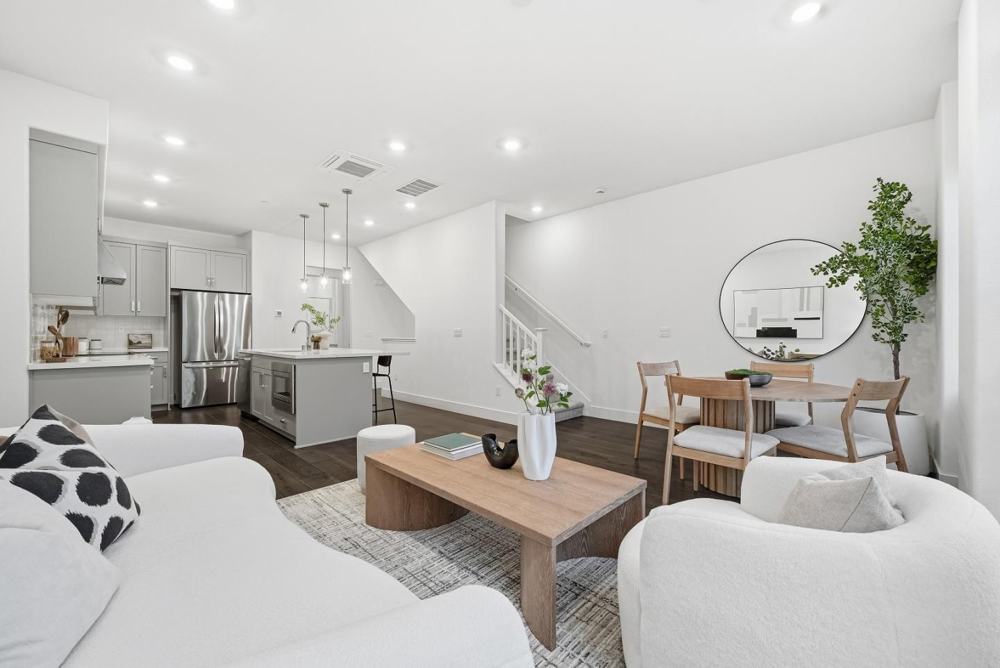 21504 Point Reyes Terrace Cupertino, CA 95014 - Photo 5 of 55 a living room with furniture kitchen view and a large mirror