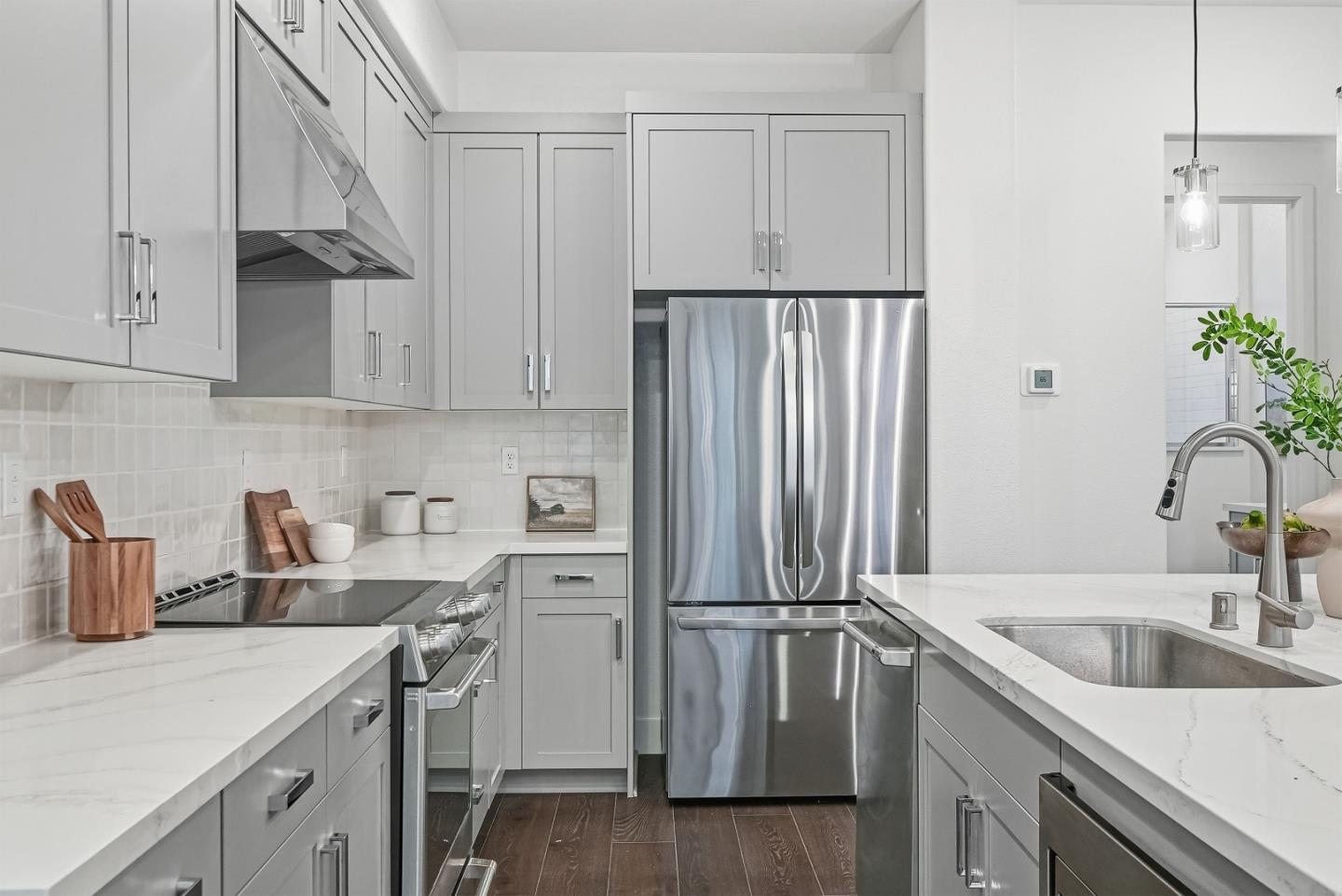 21504 Point Reyes Terrace Cupertino, CA 95014 - Photo 9 of 55 a kitchen with a sink appliances and cabinets