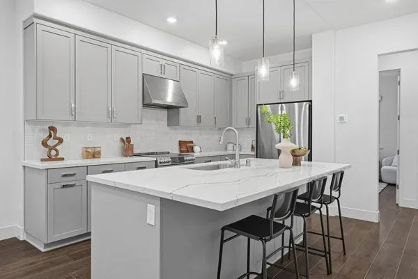 a kitchen with a table and chairs in it