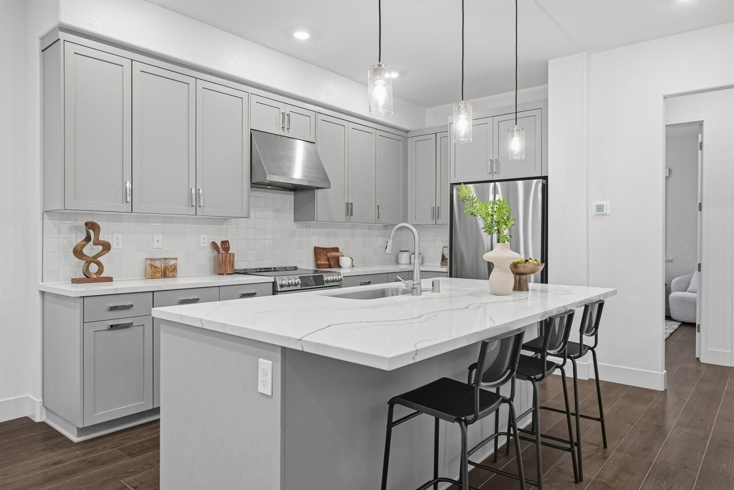 21504 Point Reyes Terrace Cupertino, CA 95014 - Photo 10 of 55 a kitchen with a table and chairs in it