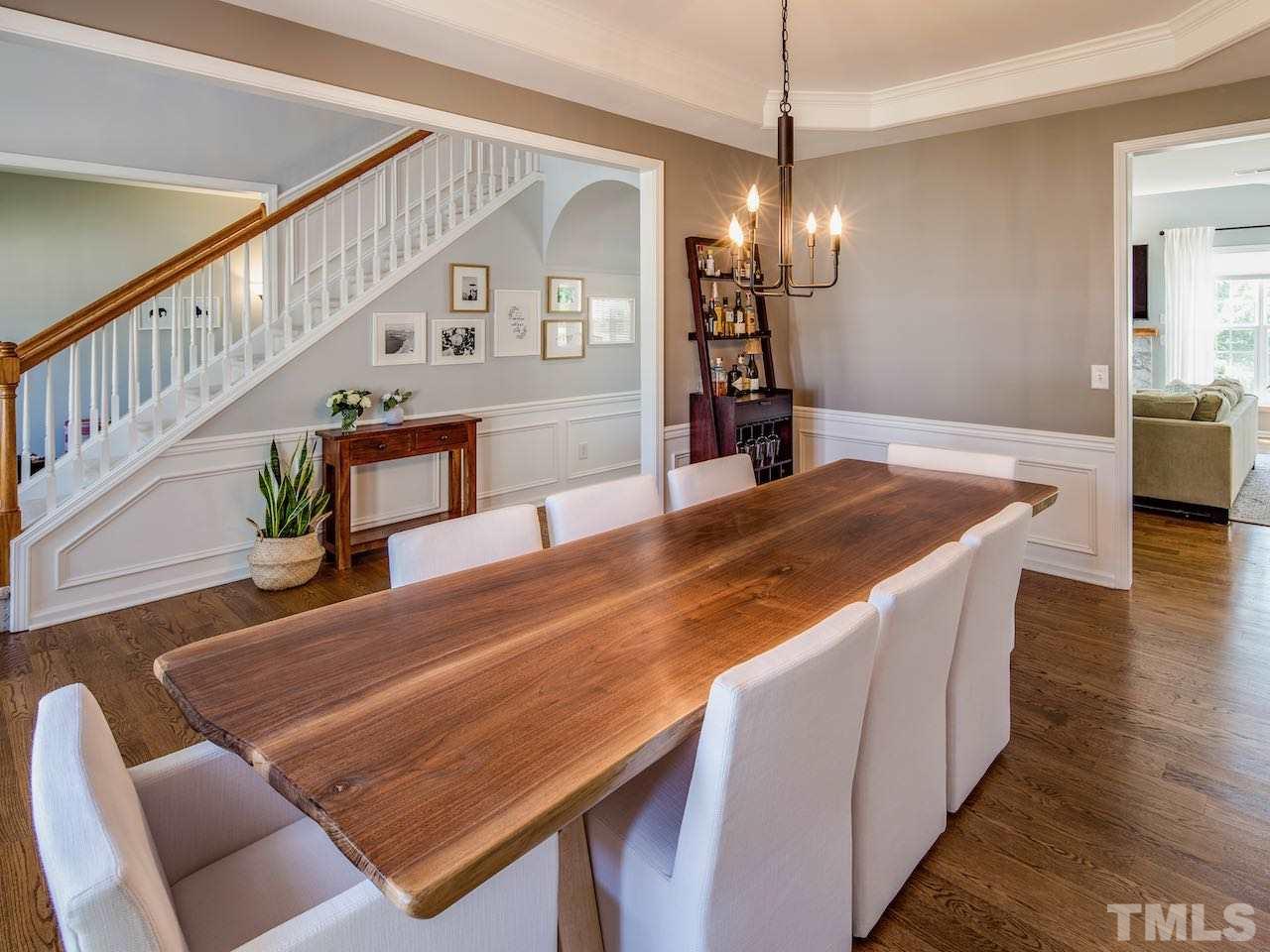 7780 Silver View Lane Raleigh, NC 27613 - Photo 9 of 30 The dining room table does not convey but the photo illustrates how easily eight people can dine in this beautiful room.