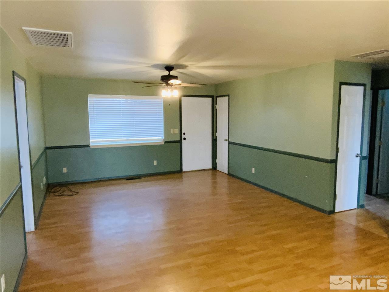 1500 Lattin Road Fallon, NV 89406 - Photo 2 of 17 a view of a room with wooden floor