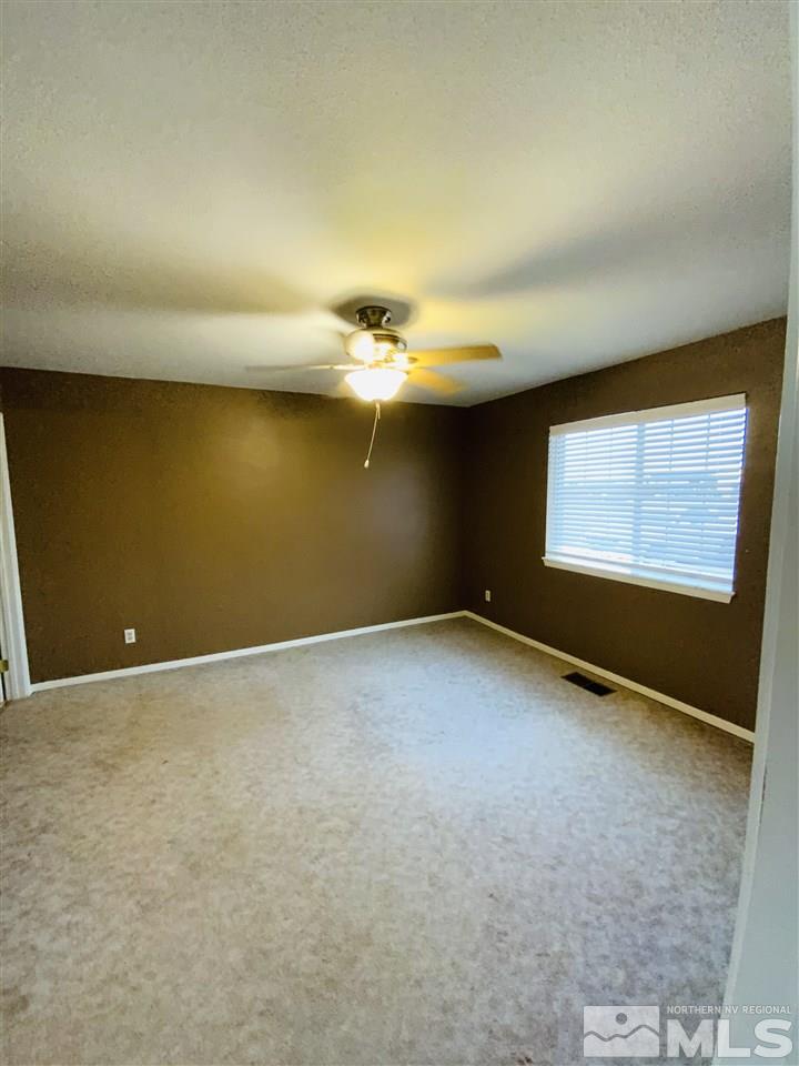 1500 Lattin Road Fallon, NV 89406 - Photo 5 of 17 a view of an empty room with a window