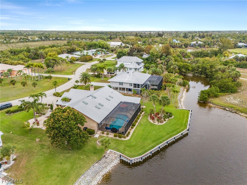 7747 Grande Pine Road Bokeelia, FL 33922 - Photo 3 of 45 an aerial view of residential houses with outdoor space and swimming pool
