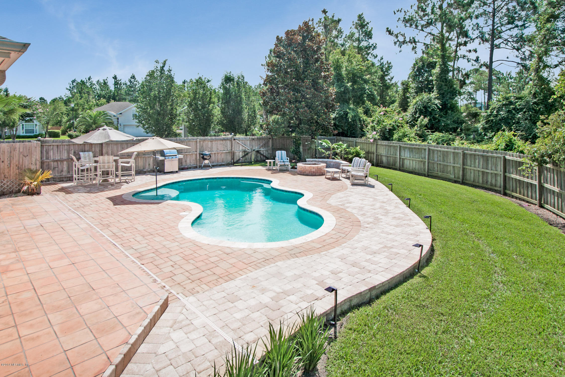 773 West Devonhurst Lane Ponte Vedra, FL 32081 - Photo 15 of 16 a swimming pool with outdoor seating and yard