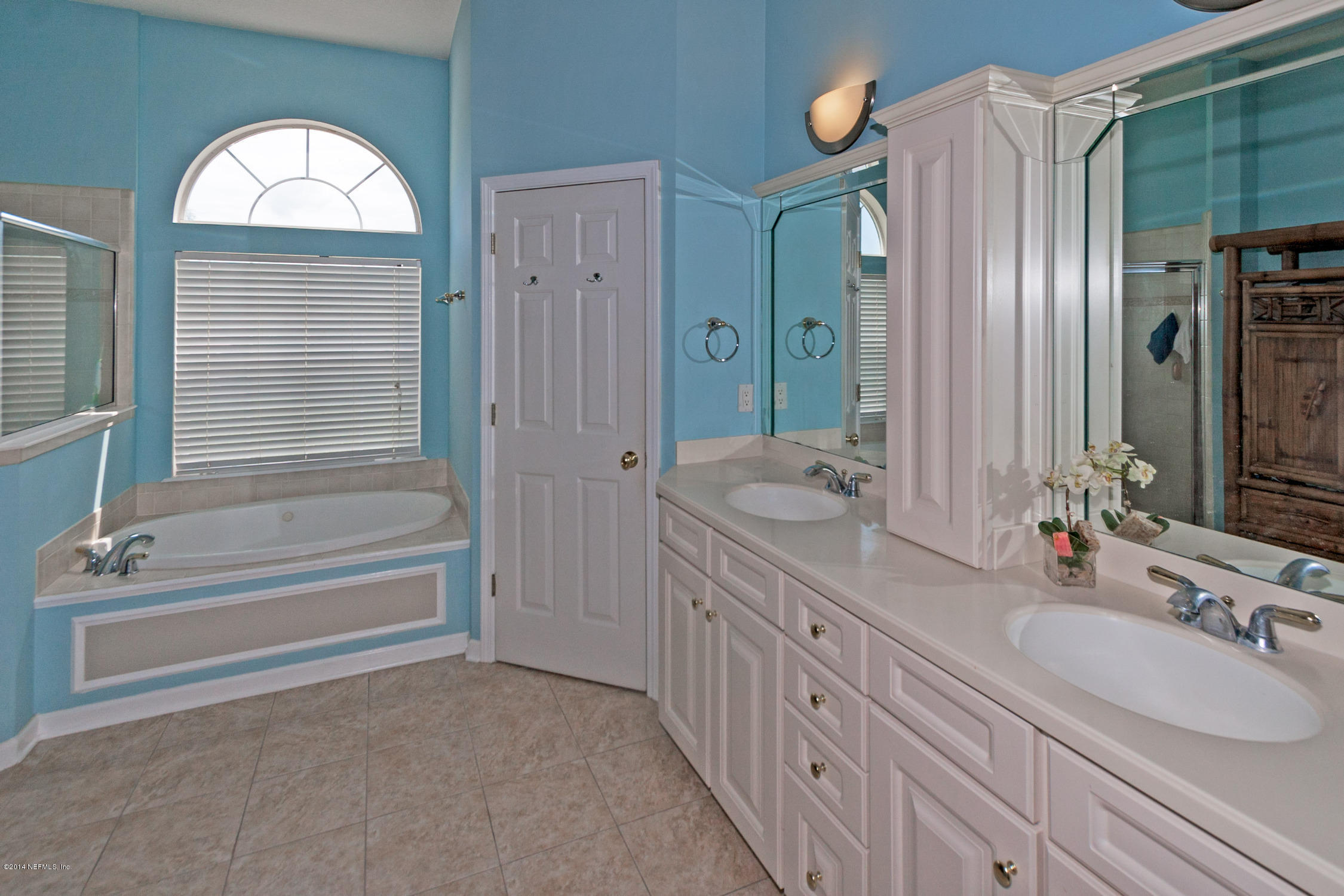 773 West Devonhurst Lane Ponte Vedra, FL 32081 - Photo 10 of 16 a bathroom with a granite countertop sink a mirror and a bathtub