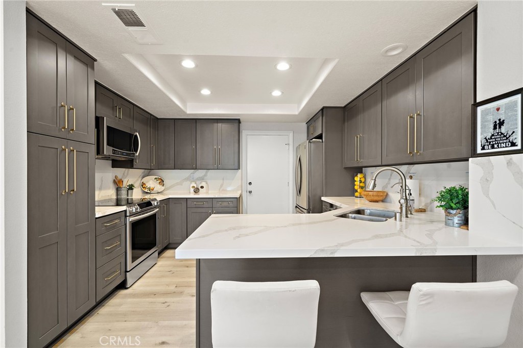 18134 Rustic Court Fountain Valley, CA 92708 - Photo 12 of 40 Quarts countertops/backslash