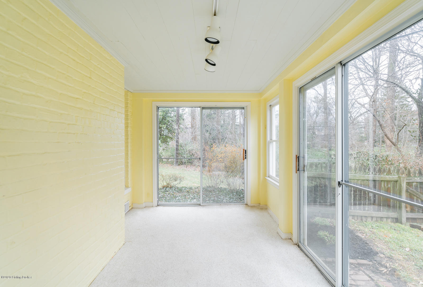 3036 Lexington Road Louisville, KY 40206 - Photo 20 of 43 Sunroom off of fireplace room with new carpeting & views of plantings from White Hall Gardens. This area has a HVAC vent.