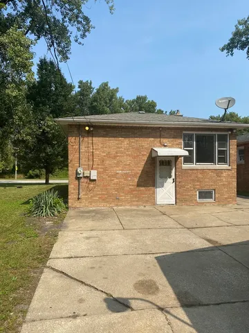 a view of a patio with a table and chairs next to an ocean
