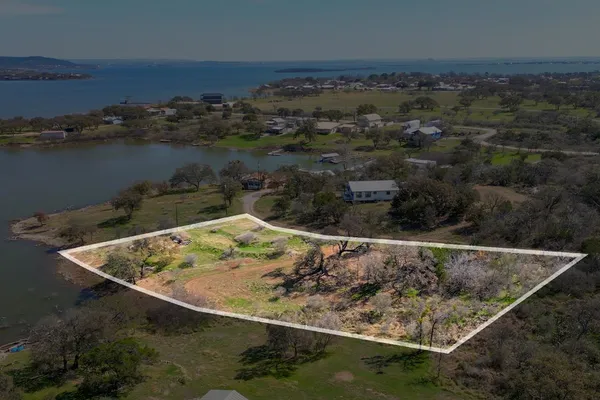 a view of balcony with wooden floor and seating space