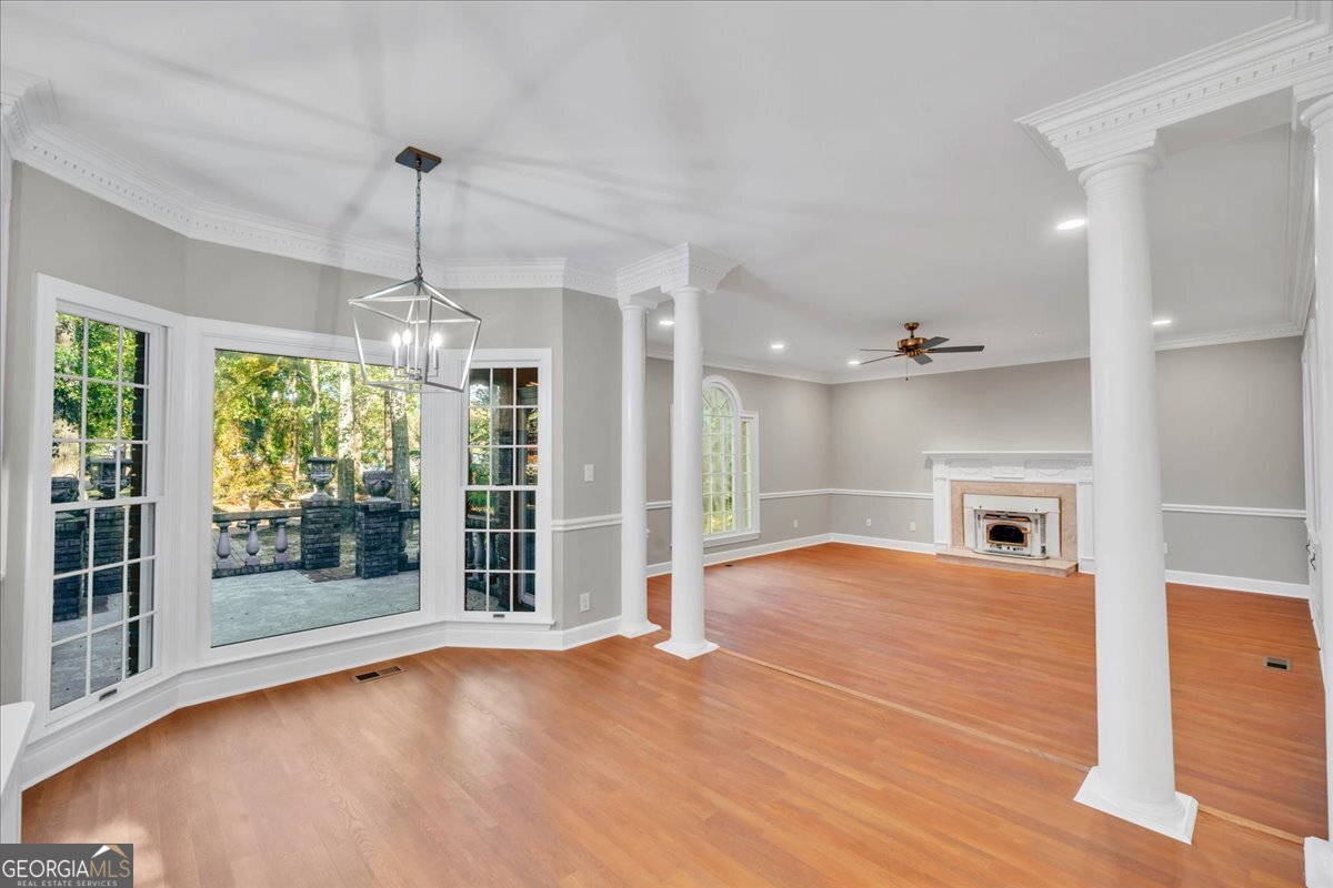 1015 Cherokee Road Perry, GA 31069 - Photo 17 of 71 a view of an empty room with window and wooden floor